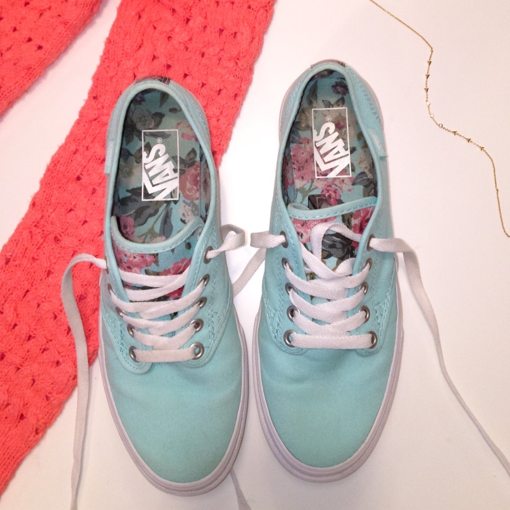 Vans brand slide on’s.